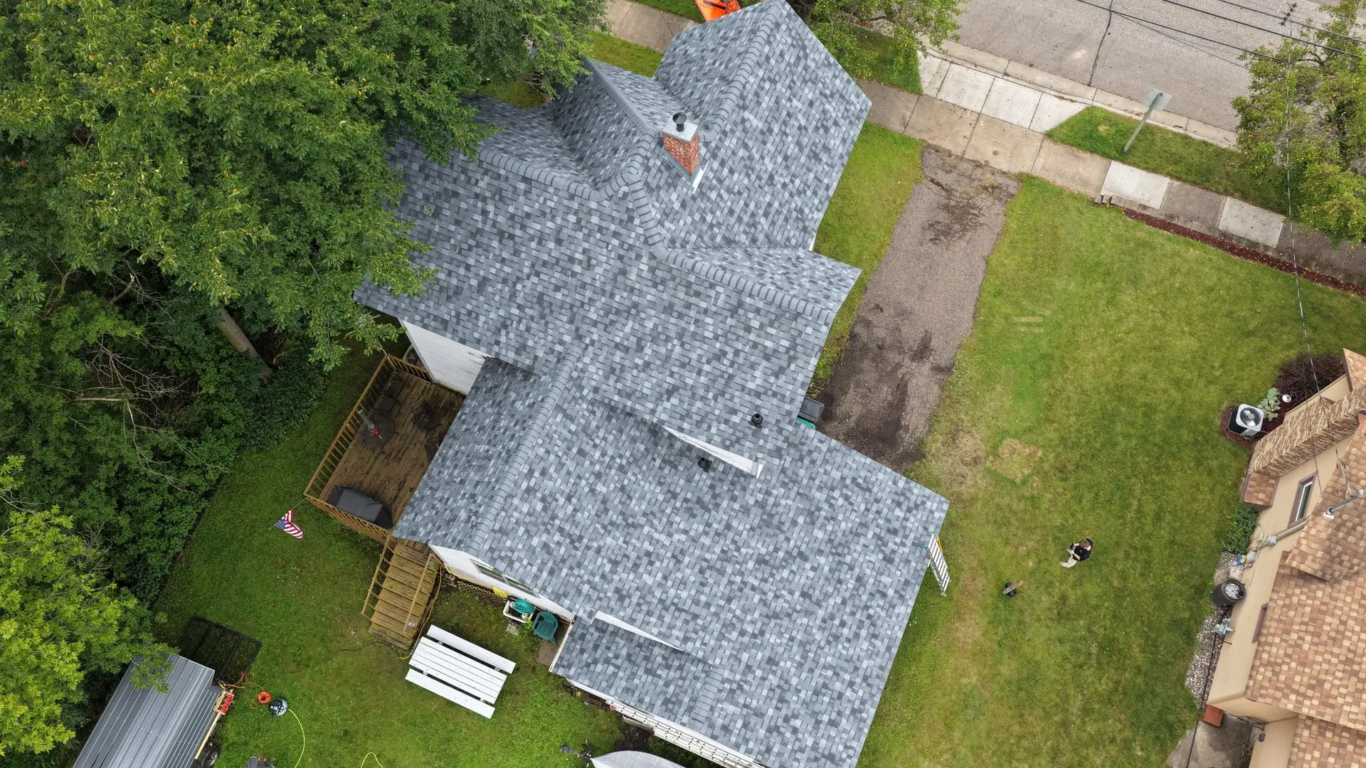 Aerial view of new shingle roof installation by Bergeron Builders