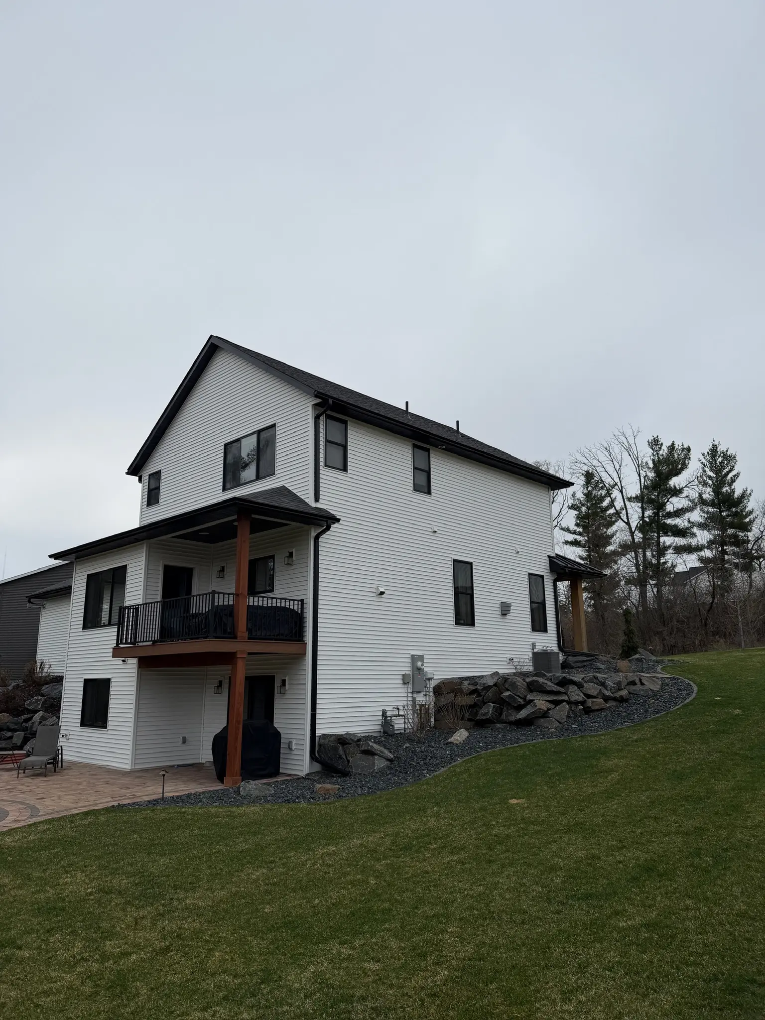 Modern home exterior remodel with deck by Bergeron Builders
